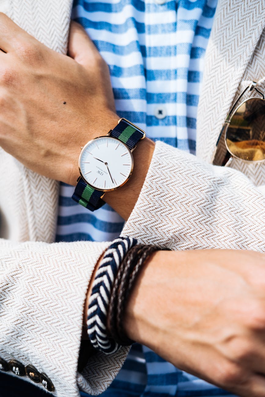 man wearing jacket and watch